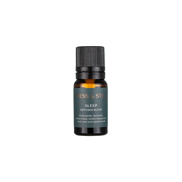 Sleep diffuser blend (with chamomile, lavender, sweet marjoram and cedarwood essential oils) in an amber glass dropper bottle with grey-green label.