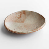 Handmade ceramic dish in rust and wheat. Made by Colleen Hennessey.