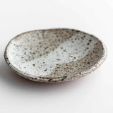 Handmade ceramic dish in very speckled matte. Made by Colleen Hennessey