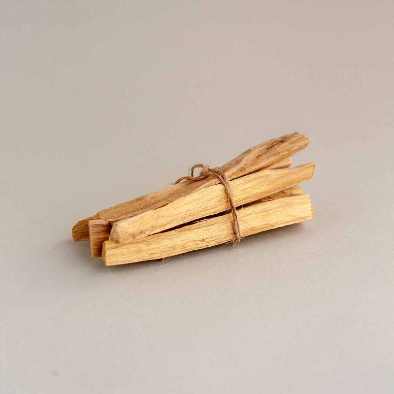 A bundle of six palo santo sticks, perfect for smudging or settling into meditation.