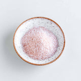 Relax bath soak made with Himalayan salt and essential oils and extracts of lavender, ylang ylang, vanilla and sandalwood. Shown in a speckle glaze dish.