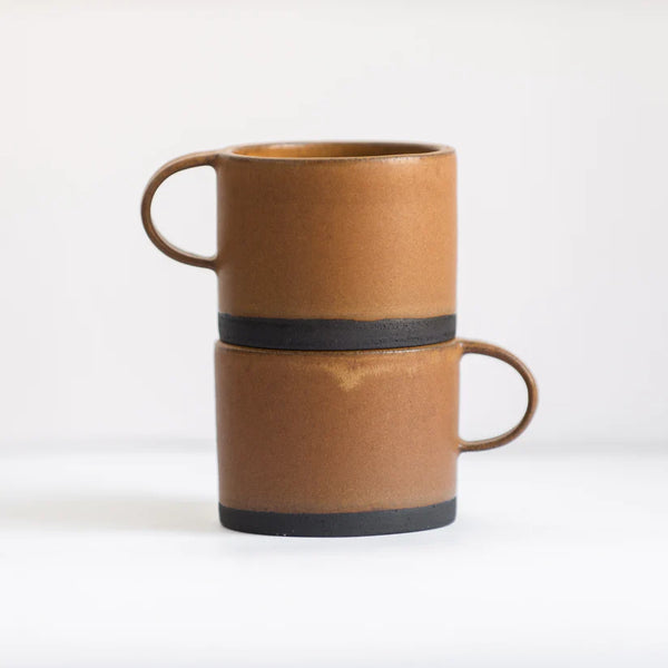 Two Wabi-Sabi stoneware mugs with matte glaze in brown.