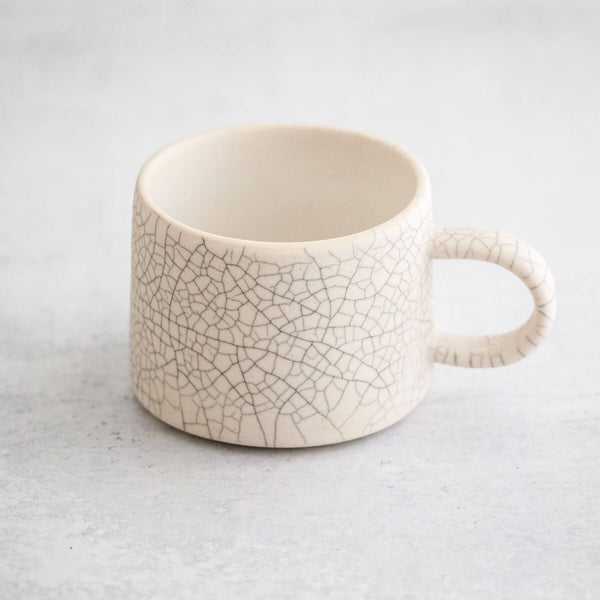 Velvety matte white low mug with crackle glaze by Earthen.