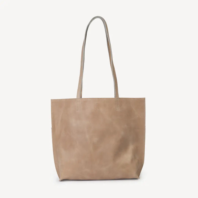 JOYN Bags' Everyday Tote in light Fog leather. Sustainably made with full-grain remnant leather. Shown from the front. The JOYN logo is stamped into the top of the bag.