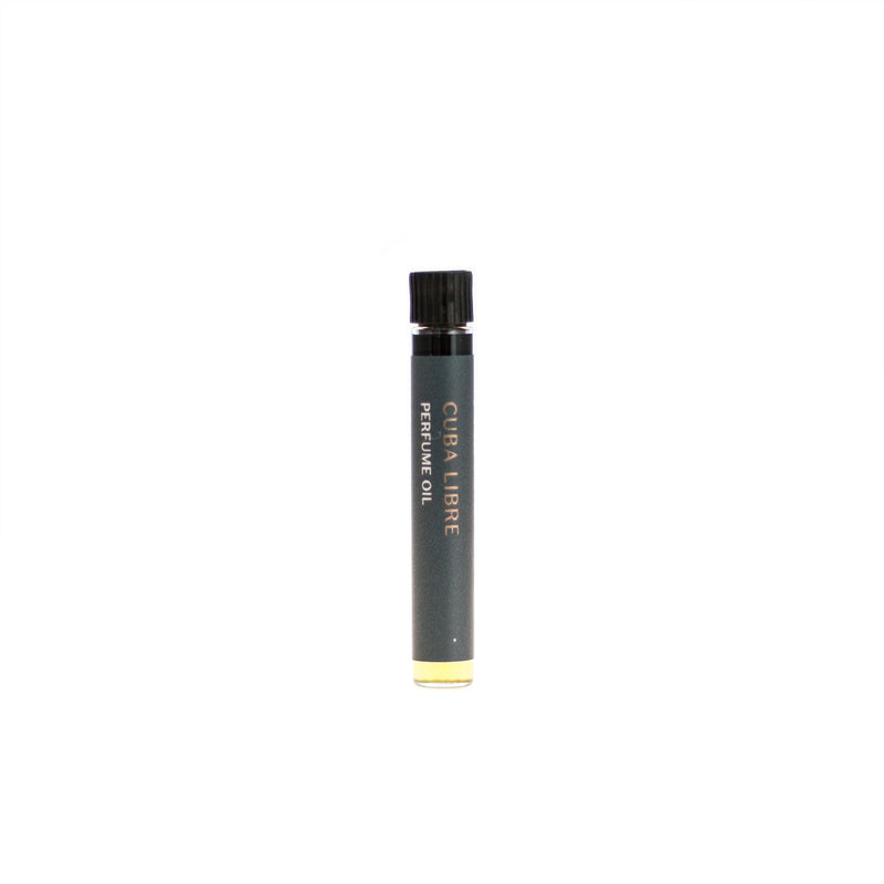 Cuba Libre botanical perfume oil (0.03 fl oz/1 ml). Organic jojoba exquisitely scented with refreshing lemon-lime citrus, sweet-spicy cinnamon and woody, tobacco-like vanilla essential oils and extracts.