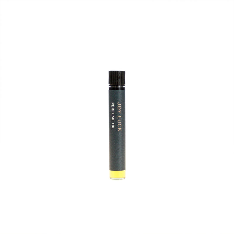 Joy Luck botanical perfume oil (0.03 fl oz/1 ml). Organic jojoba exquisitely scented with bright bergamot, elegant orange blossom and delicate, musky ambrette seed essential oils and extracts.