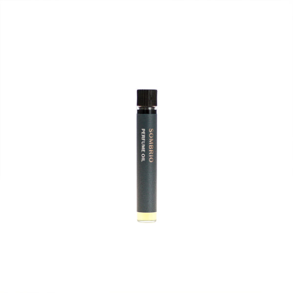 Sombrio botanical perfume oil (0.03 fl oz/1 ml). Organic jojoba exquisitely scented with fresh fir, musky spruce, smoky guaiacwood and leathery oud essential oils.