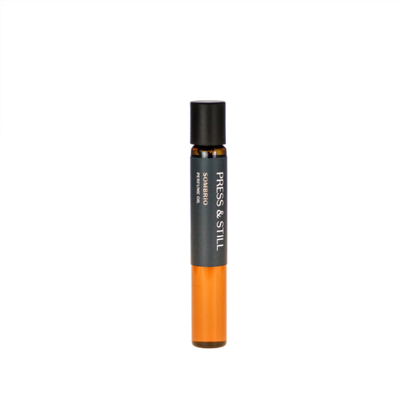 Sombrio botanical perfume oil (0.33 fl oz/10 ml). Organic jojoba exquisitely scented with fresh fir, musky spruce, smoky guaiacwood and leathery oud essential oils.